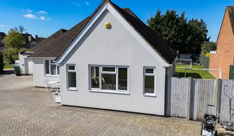 The same bungalow with clean bright white render after soft washing